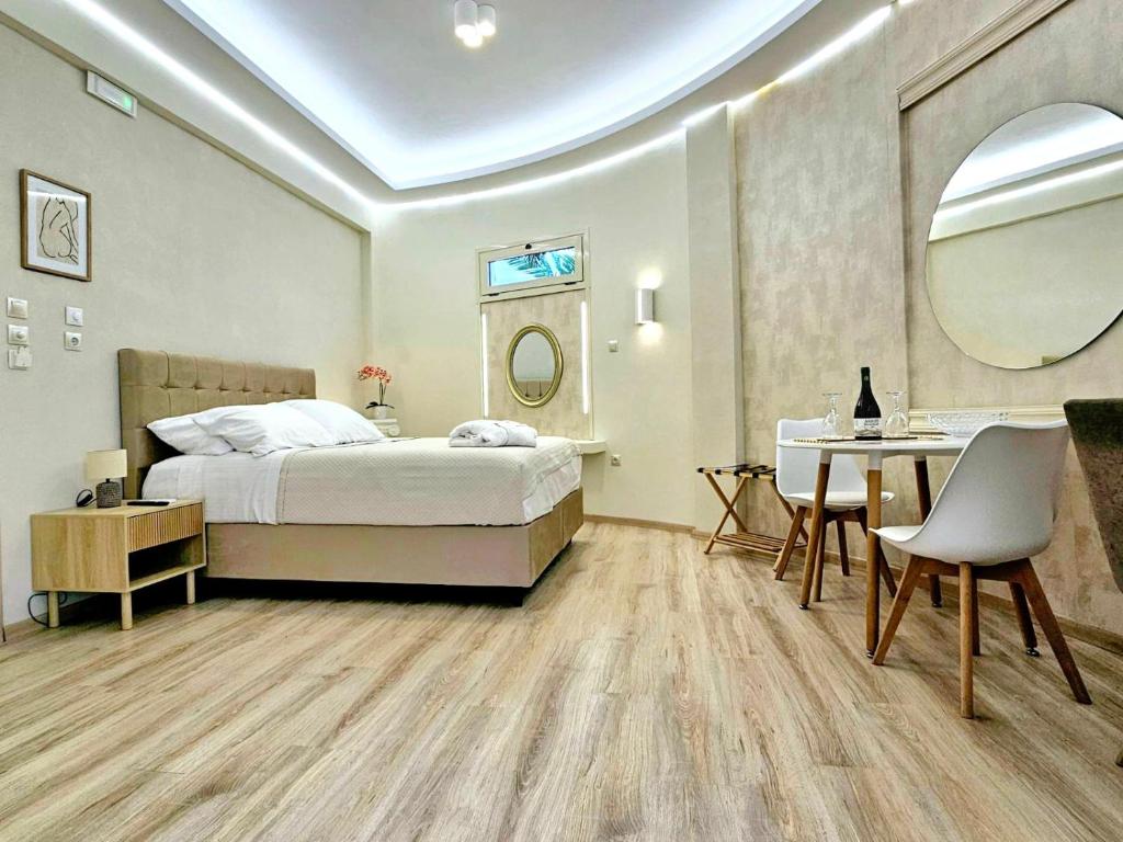 Postel nebo postele na pokoji v ubytování Golden City Center Suites