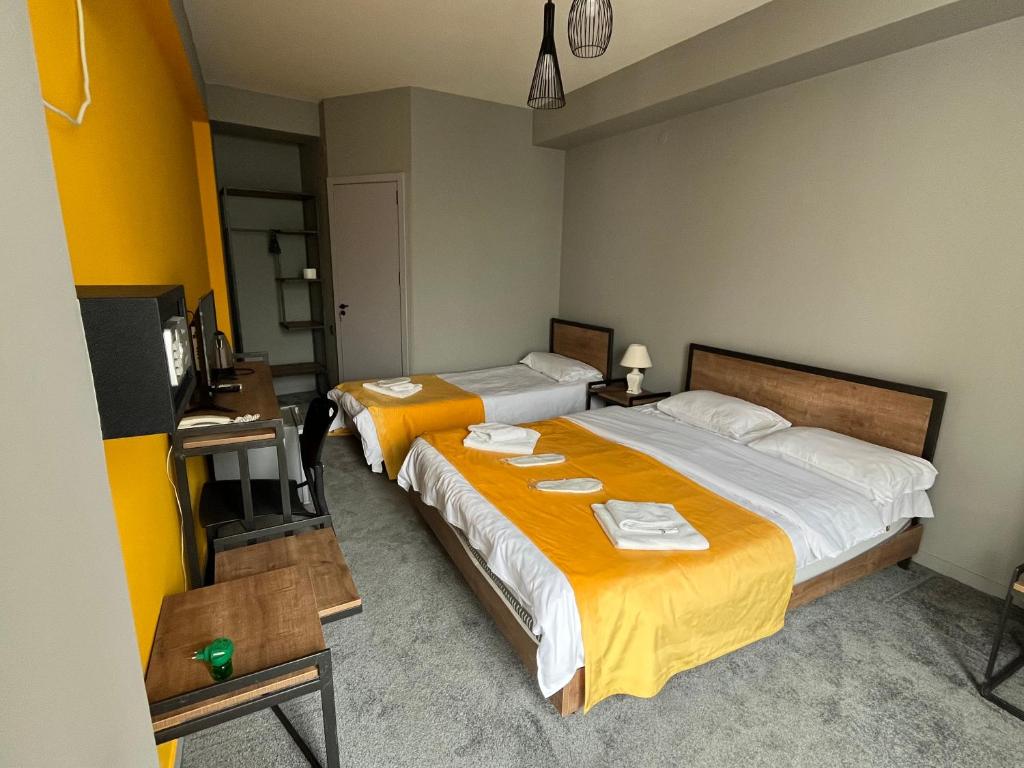 Postel nebo postele na pokoji v ubytování Diuma Hotel