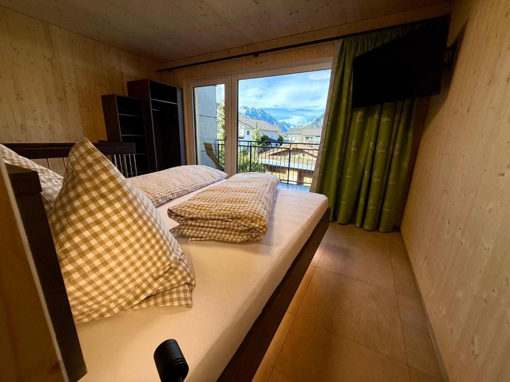 Postel nebo postele na pokoji v ubytování TinyHome Singer - inclusive private Sauna