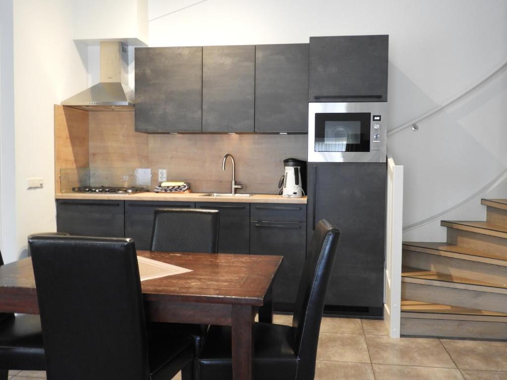 Kuchyň nebo kuchyňský kout v ubytování Apartement De Vosseburch