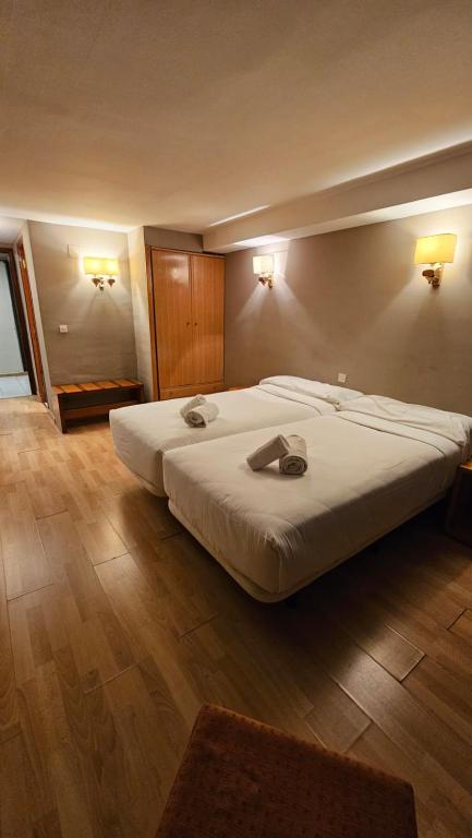 Postel nebo postele na pokoji v ubytování Pic Maià Mountain Hotel