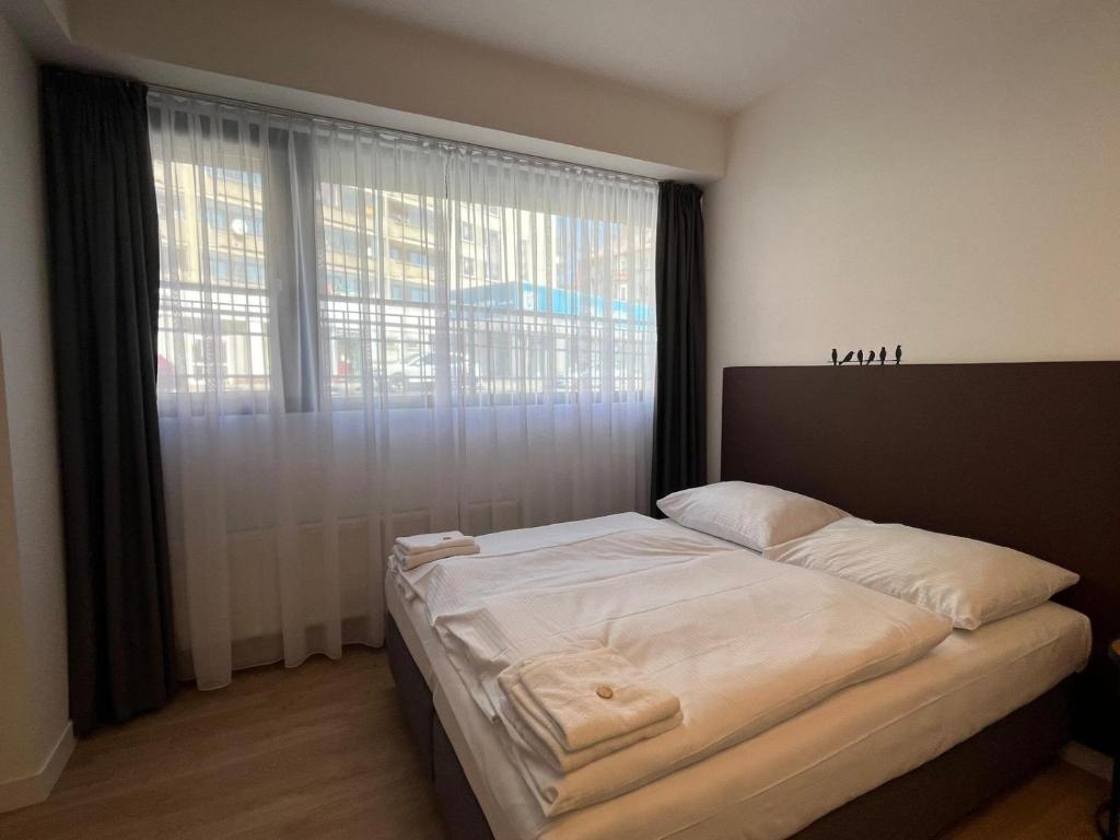 Postel nebo postele na pokoji v ubytování Post 120 Suites