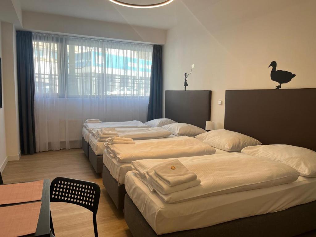 Postel nebo postele na pokoji v ubytování Post 120 Suites