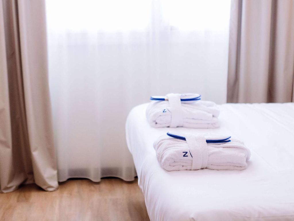 Postel nebo postele na pokoji v ubytování Novotel Montpellier