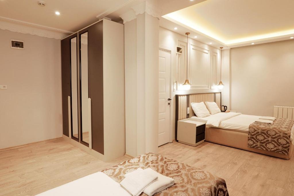 Postel nebo postele na pokoji v ubytování Ararat Hotel
