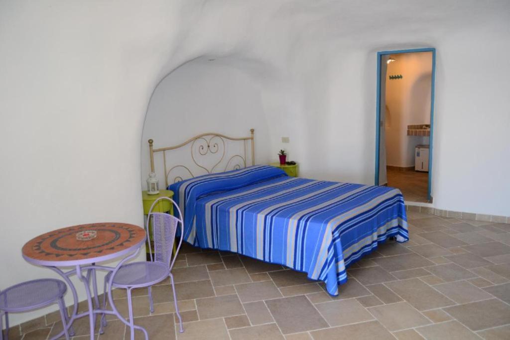 Postel nebo postele na pokoji v ubytování Maridea - Cave Apartments