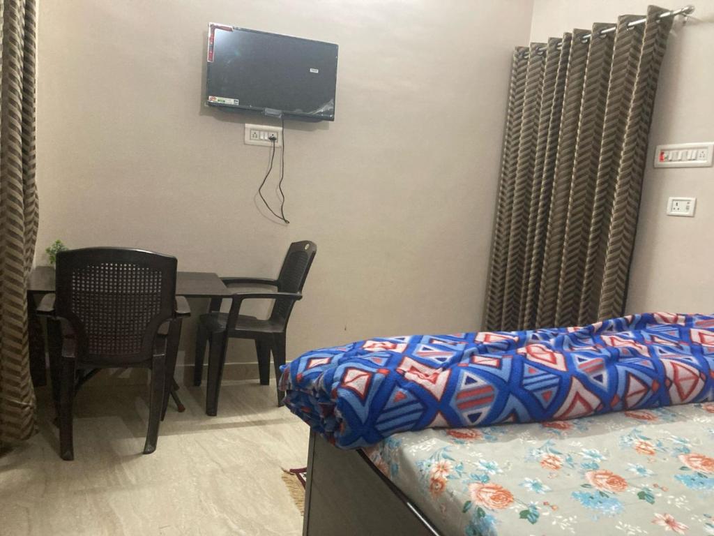 Postel nebo postele na pokoji v ubytování Prakash homestay