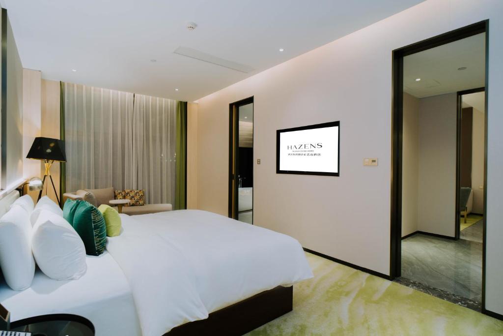 Ένα ή περισσότερα κρεβάτια σε δωμάτιο στο Wuhan Hazens Hotel