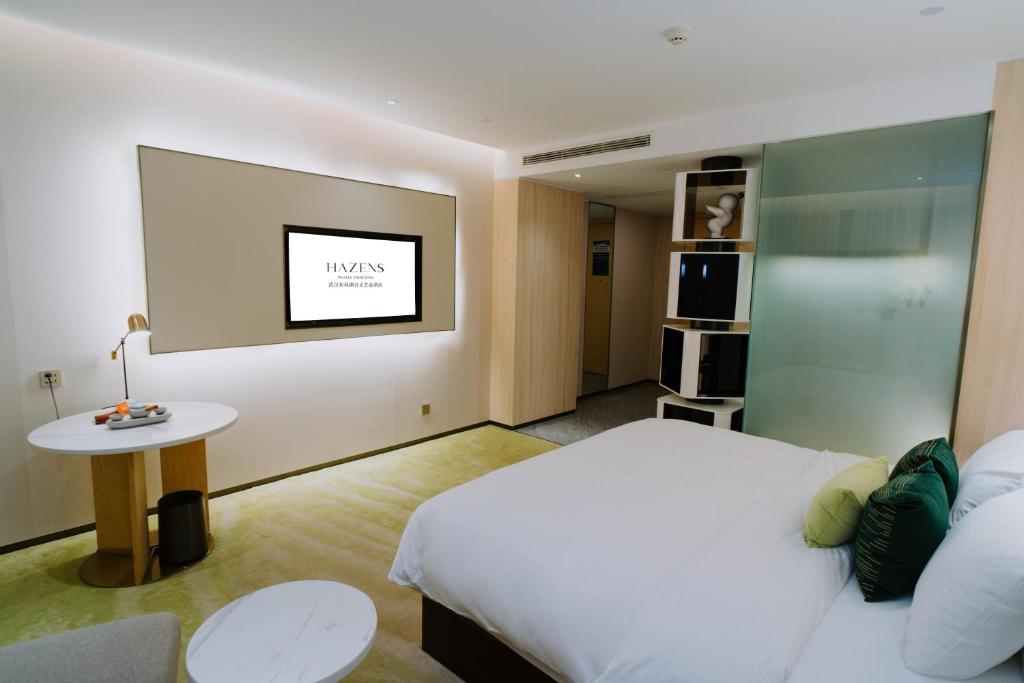 Ένα ή περισσότερα κρεβάτια σε δωμάτιο στο Wuhan Hazens Hotel