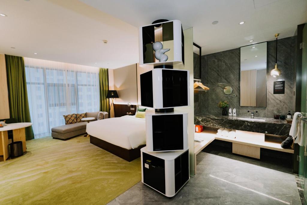 Ένα ή περισσότερα κρεβάτια σε δωμάτιο στο Wuhan Hazens Hotel