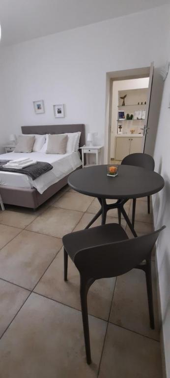 Postel nebo postele na pokoji v ubytování Efebo Rooms