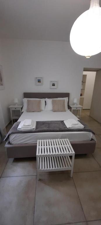 Postel nebo postele na pokoji v ubytování Efebo Rooms