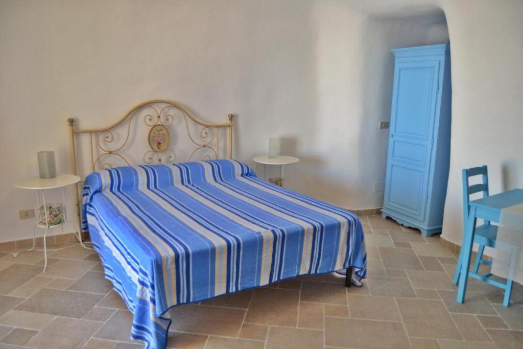 Postel nebo postele na pokoji v ubytování Maridea - Cave Apartments