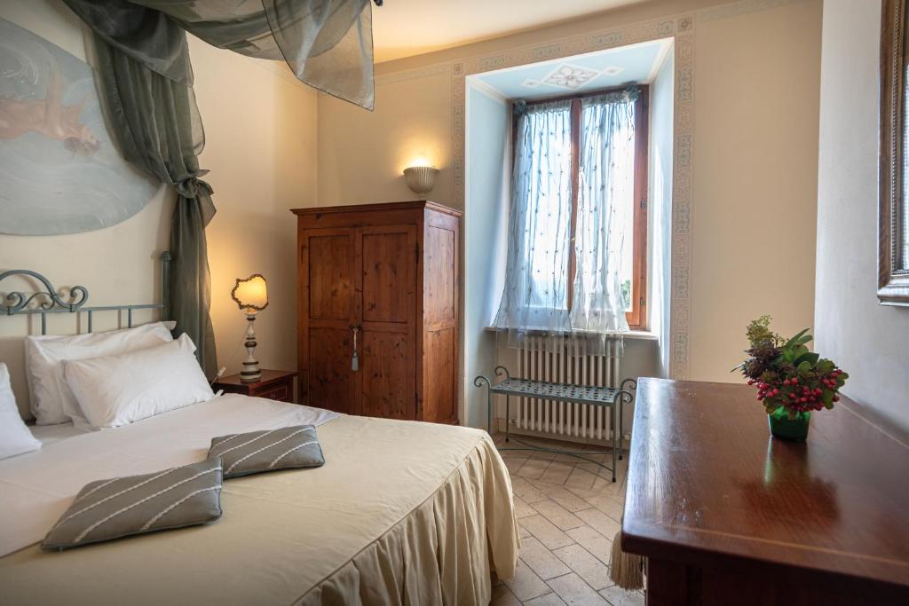Posteľ alebo postele v izbe v ubytovaní Residenza D'epoca San Crispino