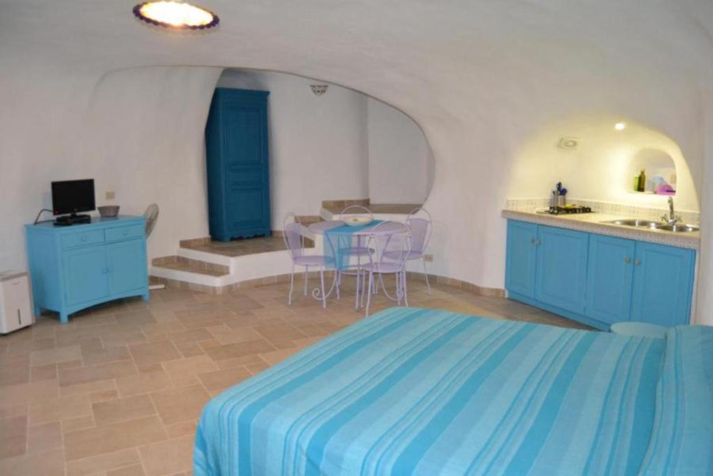 Postel nebo postele na pokoji v ubytování Maridea - Cave Apartments