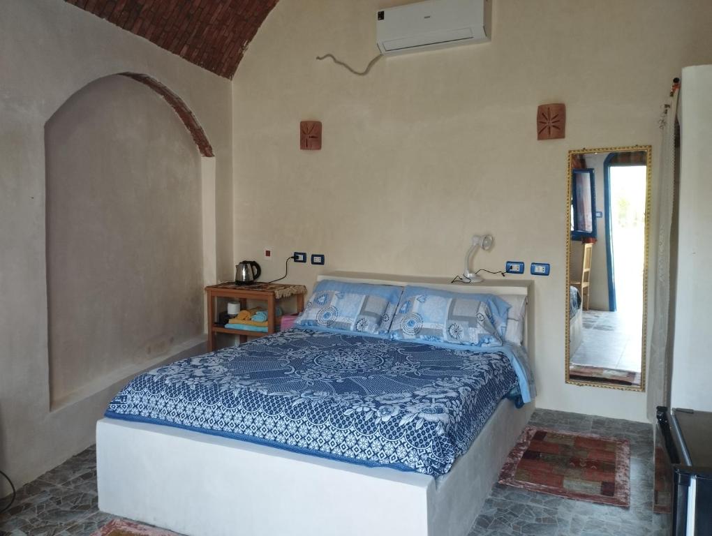 Postel nebo postele na pokoji v ubytování Nubian Lotus