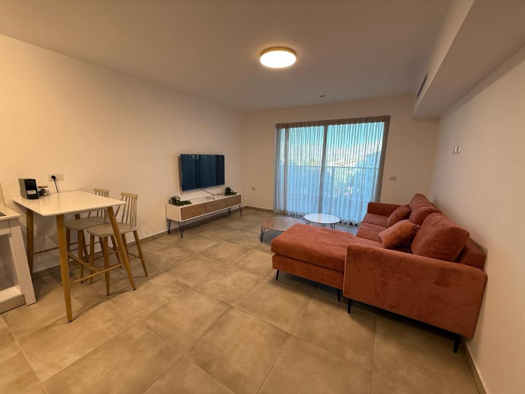 TV a/nebo společenská místnost v ubytování J&G Suites