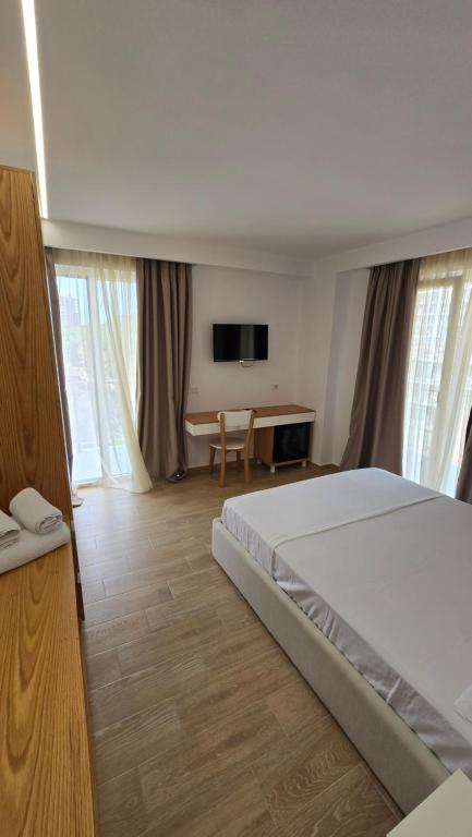 Postel nebo postele na pokoji v ubytování Alcani Hotel