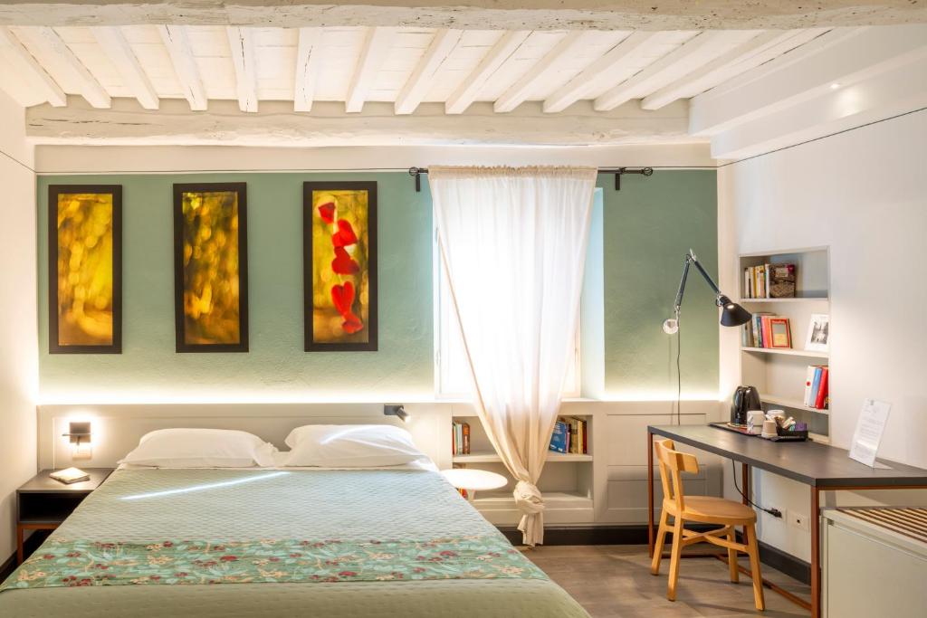 Postel nebo postele na pokoji v ubytování Duccio Nacci Rooms- Guesthouse