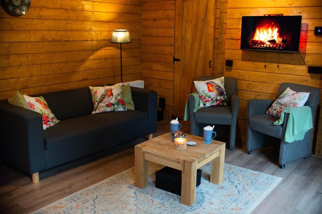 Posezení v ubytování Charmant, gezellig en knus 5p chalet op Veluwe naast Sauna Drome