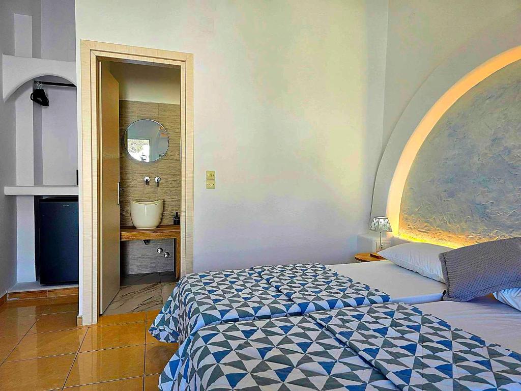 Postel nebo postele na pokoji v ubytování Papafotis Apartments & Suites