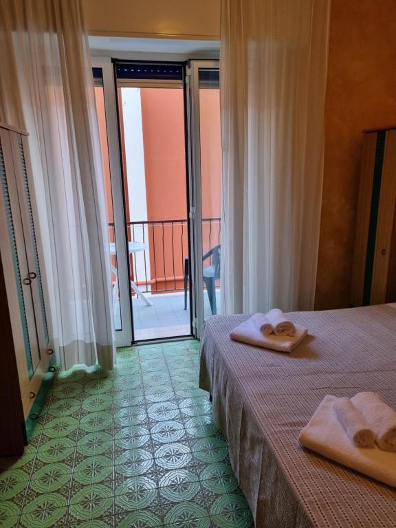 Postel nebo postele na pokoji v ubytování Albergo Stella Di Mare