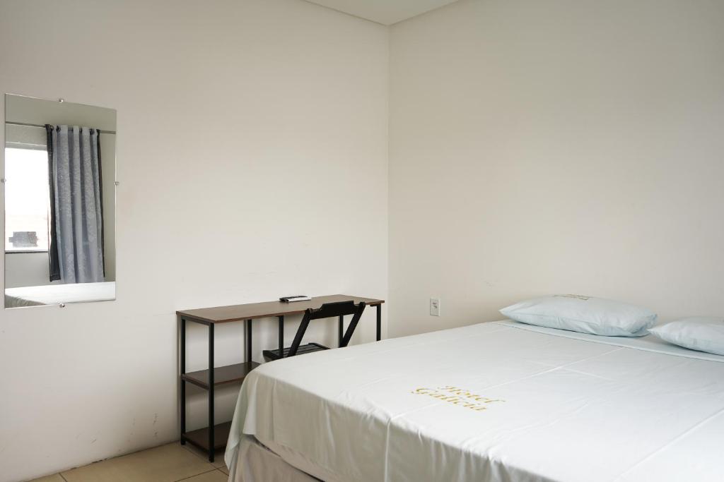 Postel nebo postele na pokoji v ubytování Hotel Galícia