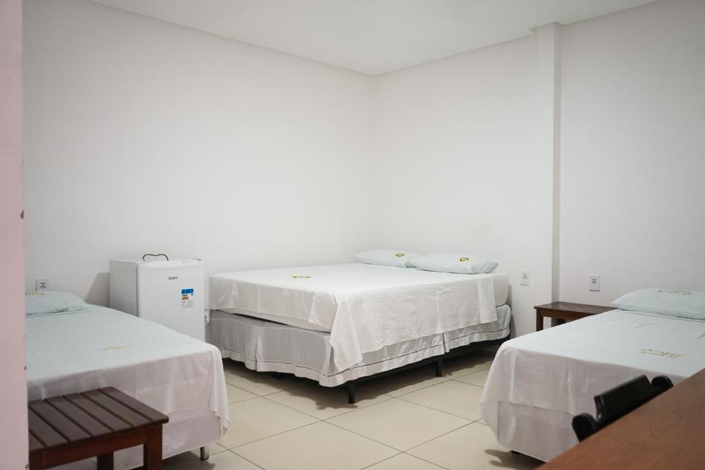 Postel nebo postele na pokoji v ubytování Hotel Galícia