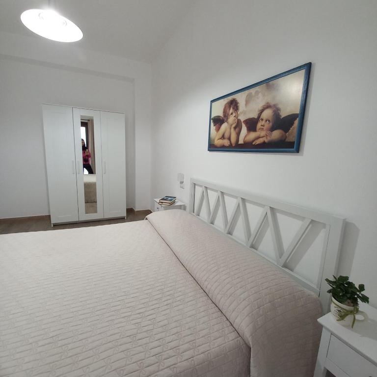 Postel nebo postele na pokoji v ubytování WindwoW - Your flat in Baunei