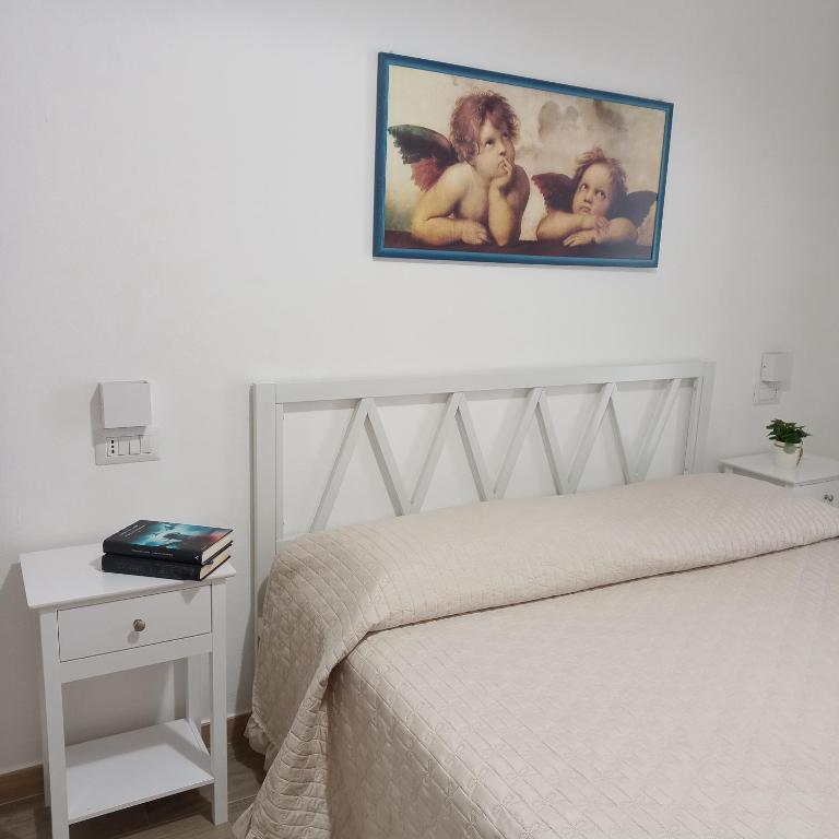 Postel nebo postele na pokoji v ubytování WindwoW - Your flat in Baunei