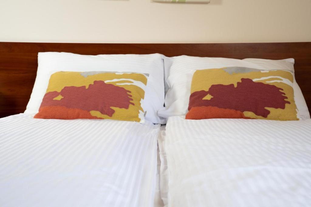 Postel nebo postele na pokoji v ubytování Amber House Swierkowa