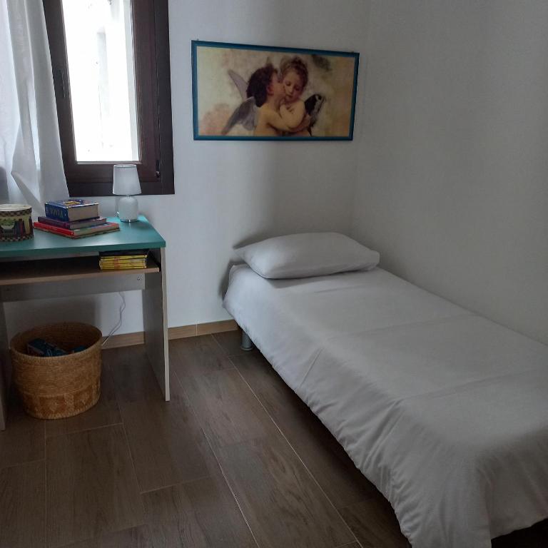 Postel nebo postele na pokoji v ubytování WindwoW - Your flat in Baunei