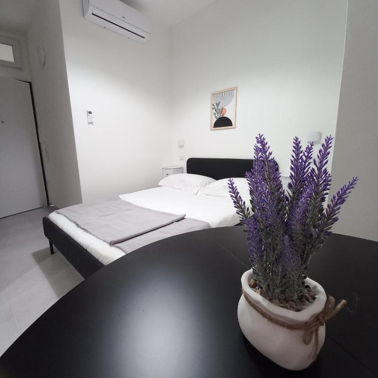 Postel nebo postele na pokoji v ubytování WindwoW - Your flat in Baunei