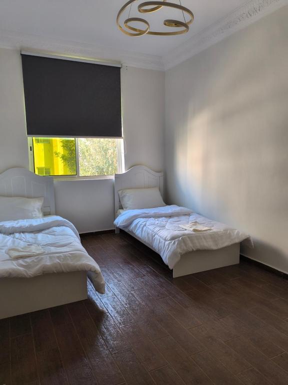 Postel nebo postele na pokoji v ubytování Aladdin guest House