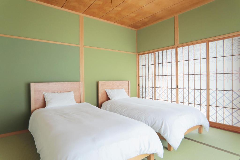 Postel nebo postele na pokoji v ubytování Yufuin Waon no Yado - Vacation STAY 18114