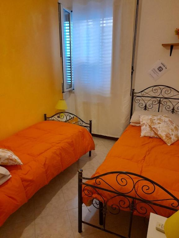 Postel nebo postele na pokoji v ubytování Dafne B&B