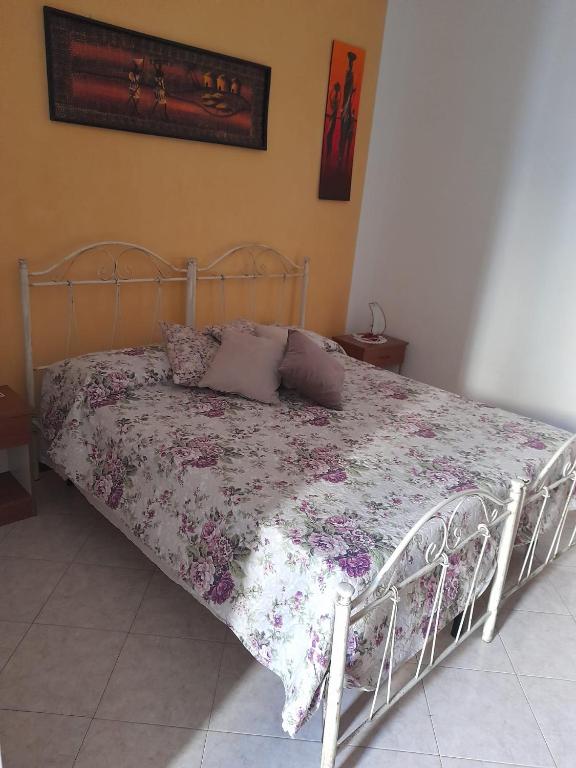 Postel nebo postele na pokoji v ubytování Dafne B&B