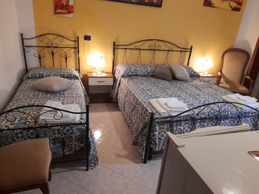 Postel nebo postele na pokoji v ubytování Dafne B&B