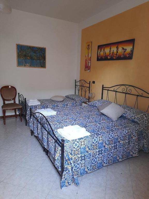 Postel nebo postele na pokoji v ubytování Dafne B&B