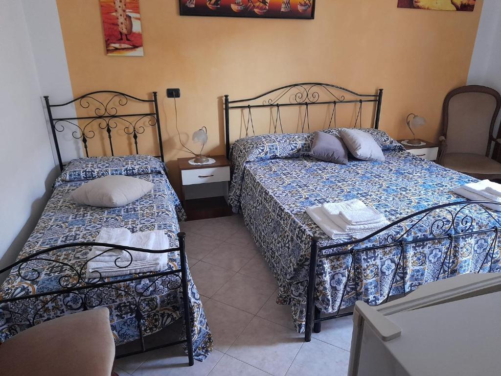 Postel nebo postele na pokoji v ubytování Dafne B&B