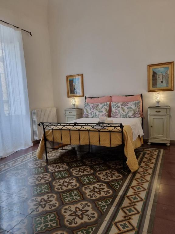 Postel nebo postele na pokoji v ubytování BnB '900 Lecce centro
