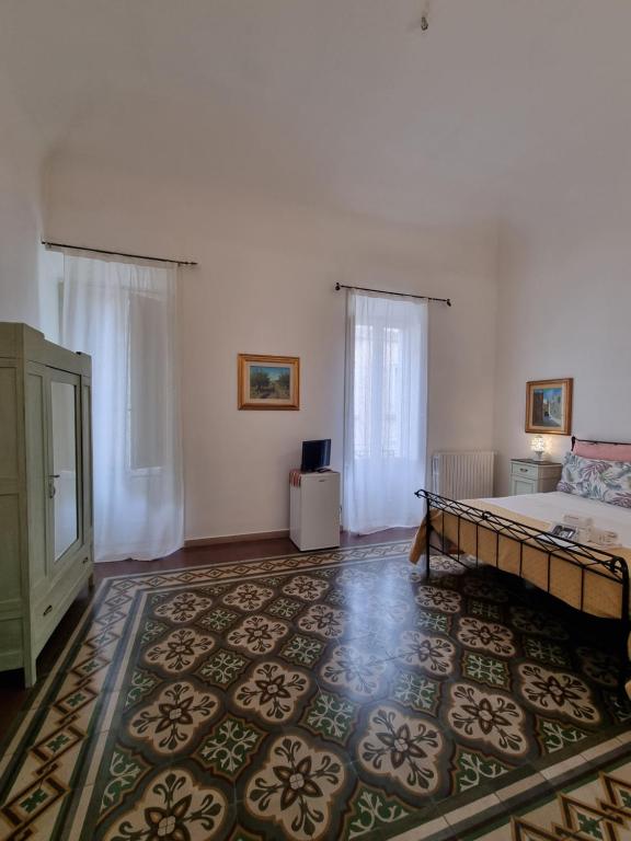 Postel nebo postele na pokoji v ubytování BnB '900 Lecce centro