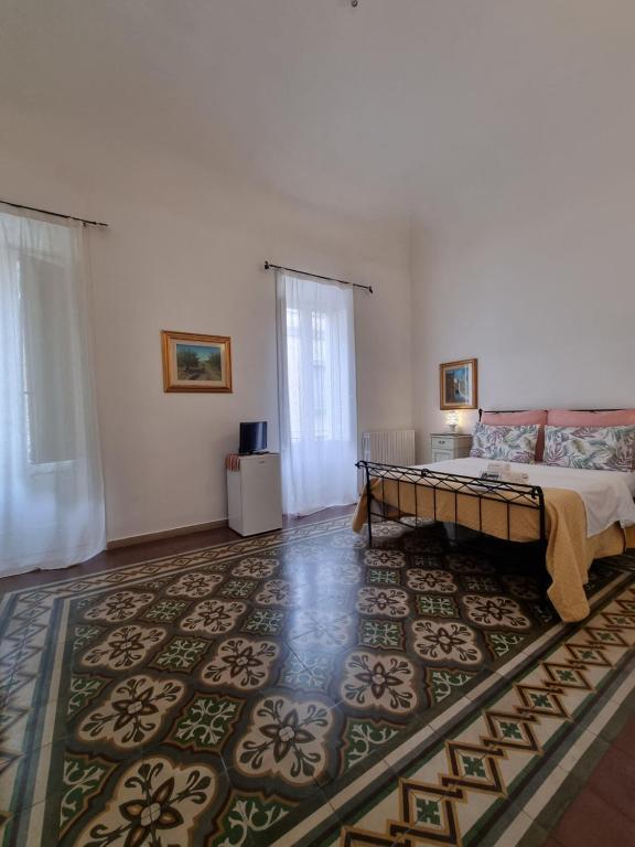 Postel nebo postele na pokoji v ubytování BnB '900 Lecce centro