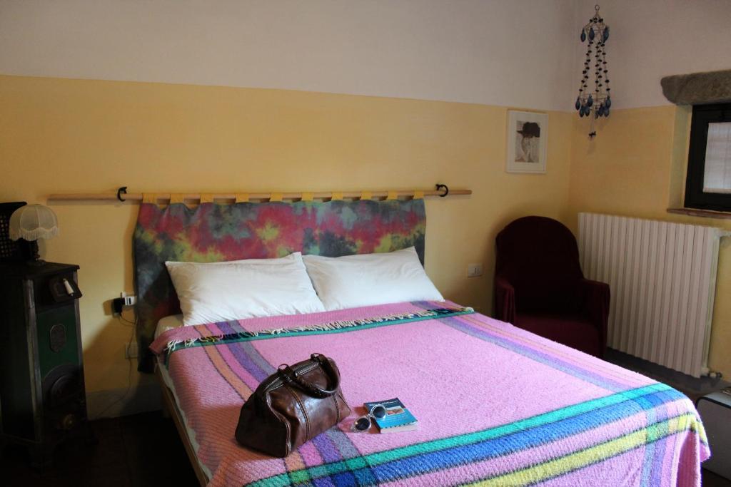 Postel nebo postele na pokoji v ubytování Il Cielo Bio - Il più piccolo B&B del Chianti