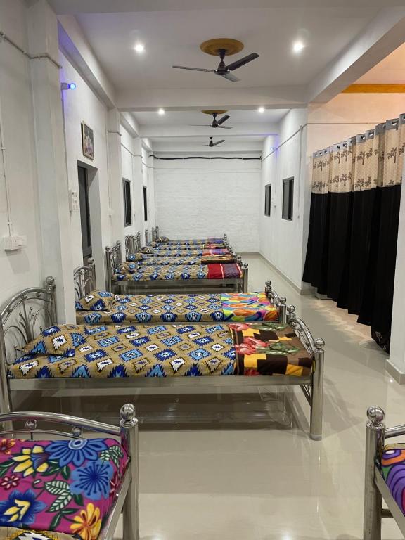 Voodi või voodid majutusasutuse Maa Janki Dormitory toas