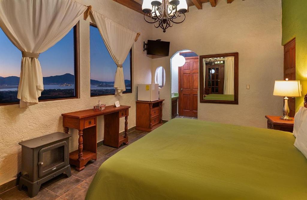 Postel nebo postele na pokoji v ubytování Eco Hotel Ixhi