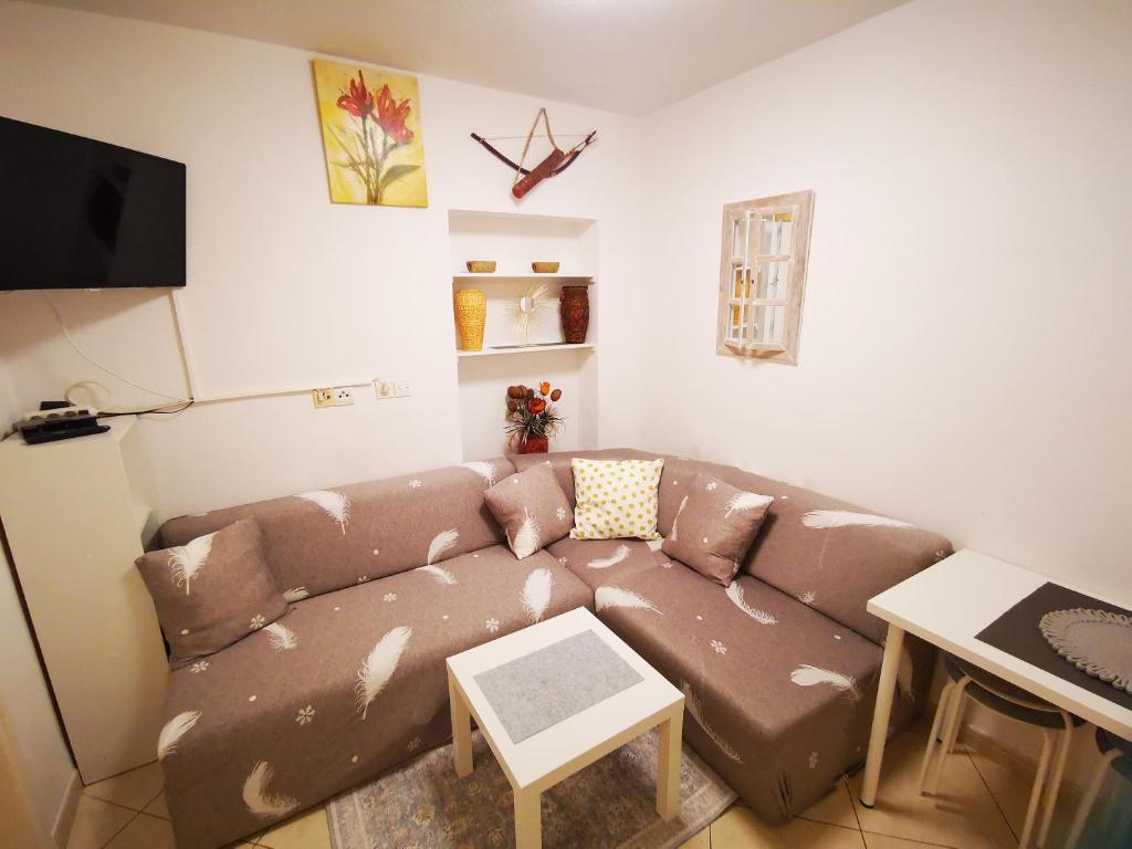 TV a/nebo společenská místnost v ubytování Apartmani Rudelj