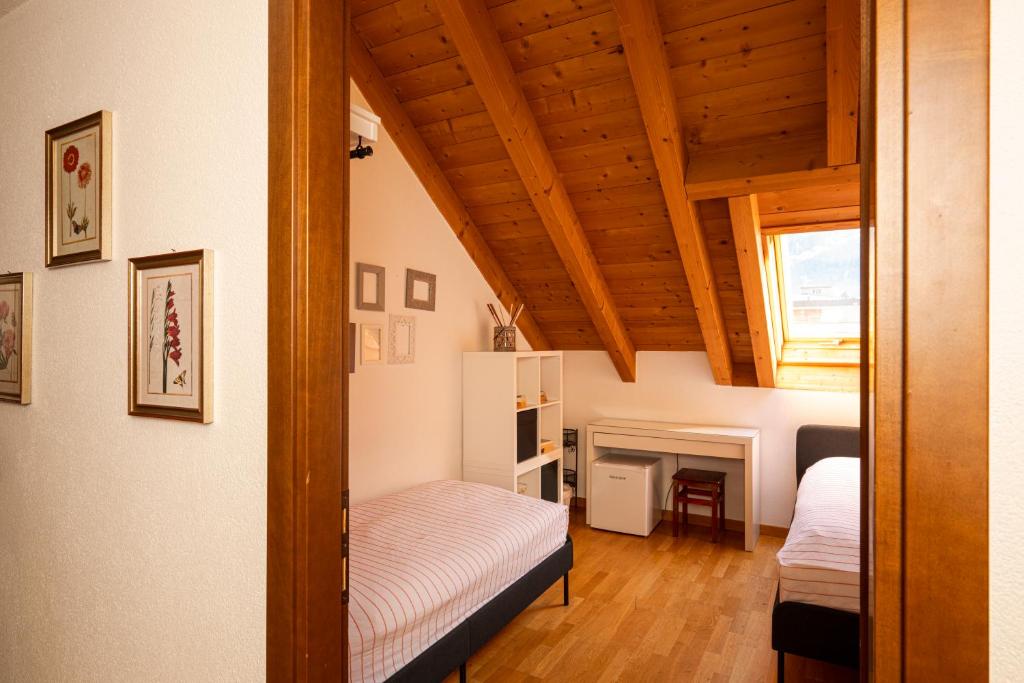 Postel nebo postele na pokoji v ubytování Bernina Express Eco Rooms&Breakfast