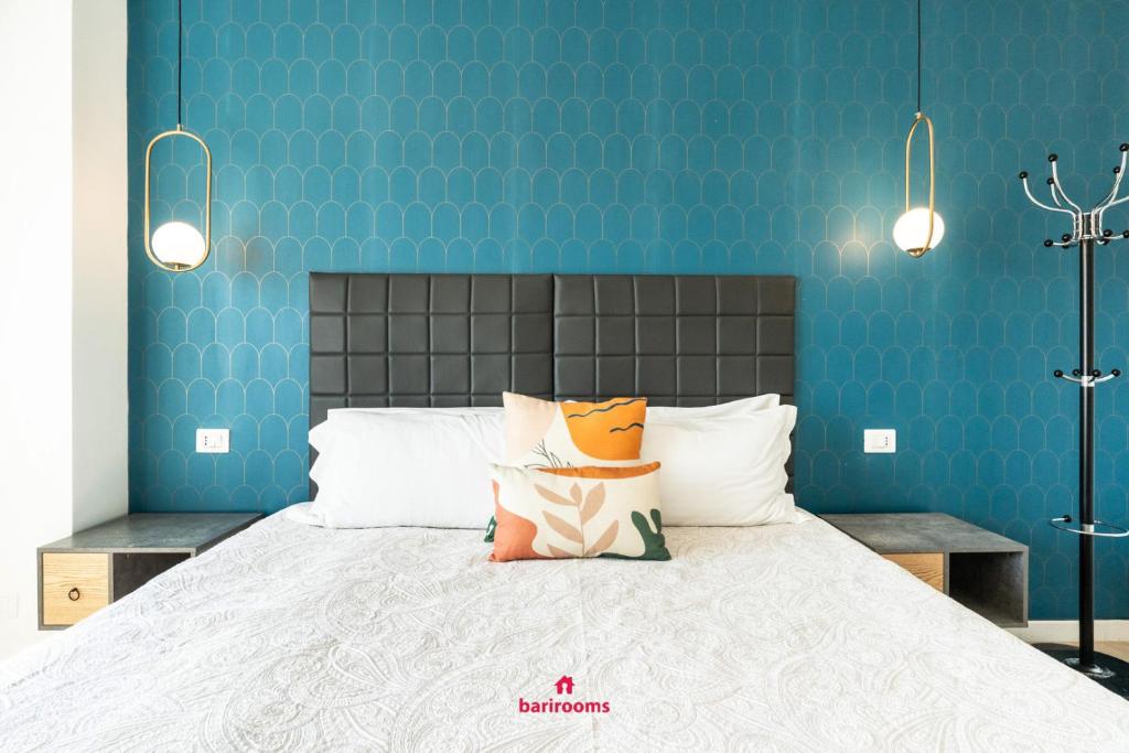 Postel nebo postele na pokoji v ubytování Barirooms - Carulli Suites