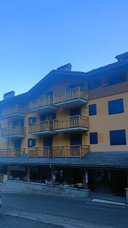 a large building with balconies on the side of it at Cotto's house in Gerola Alta